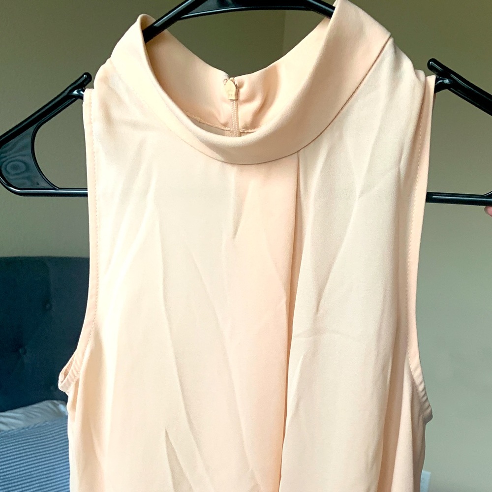 Versona women’s sheer nude top.